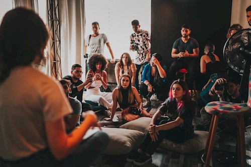 a group of peers attending a training in a relaxed setting